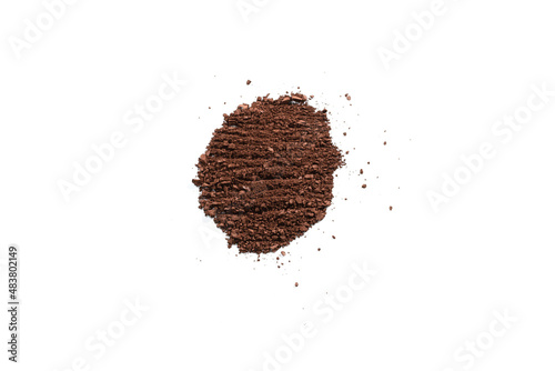 Makeup cosmetics. Eyeshadow in brown color crushed palette, colorful eye shadow powder isolated.