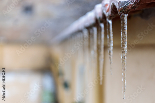 Icicles Dangling from a Rooftop