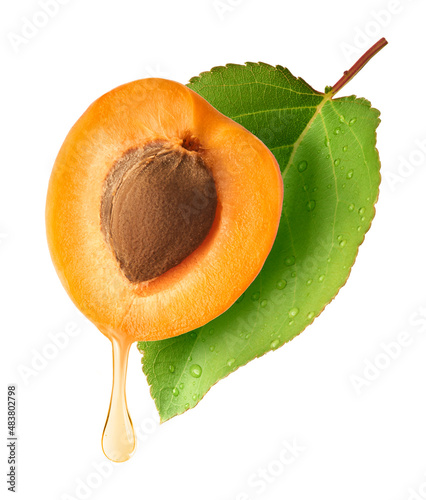 Fresh raw sweet Apricot with green leaves isolated on white background.