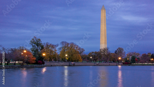 Views and reflections of the Washington Monument at dusk during fall