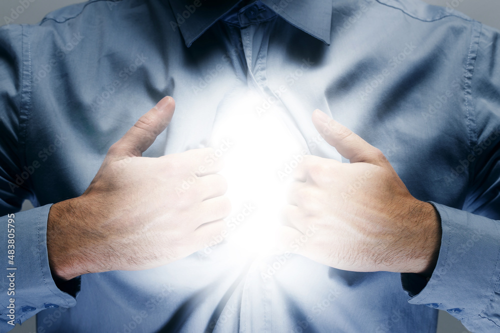 Man with shine inside his chest. Concepts of soul and personality. Man with shine inside his chest. Concepts of soul and personality.