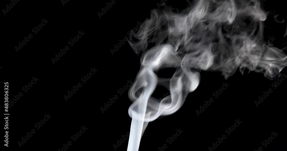 Atmospheric smoke effect. Smoke slowly floating through space against black background in 4K resolution Atmospheric smoke effect. Smoke slowly floating through space against black background in 4K resolution
