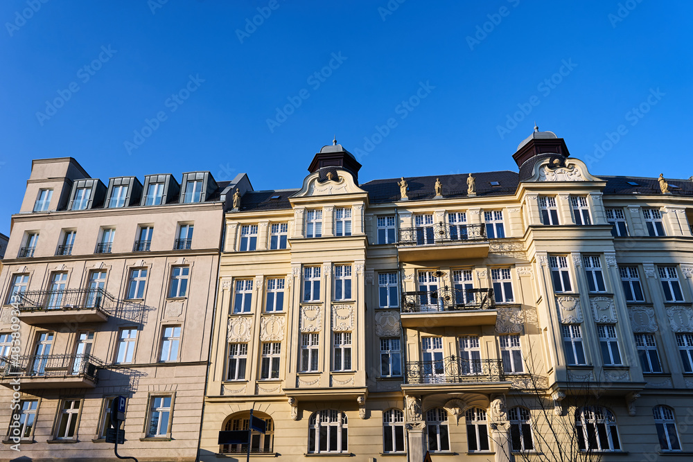 facades of historic tenement houses with balconies in the city of Poznan