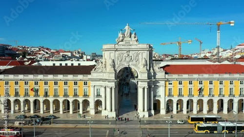 Aerial drone view of the Augusta Street Arch from Commerce Square in Lisbon, Portugal. Sunny day with blue sky. Joseph I portuguese king statue. (ID: 483811147)