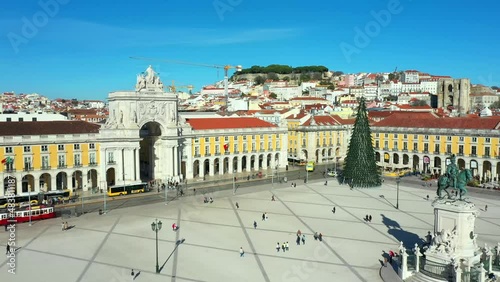 Aerial drone view of the Augusta Street Arch from Commerce Square in Lisbon, Portugal. Sunny day with blue sky. Joseph I portuguese king statue. (ID: 483811187)