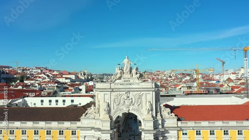 Aerial drone view of the Augusta Street Arch from Commerce Square in Lisbon, Portugal. Sunny day with blue sky. (ID: 483811531)