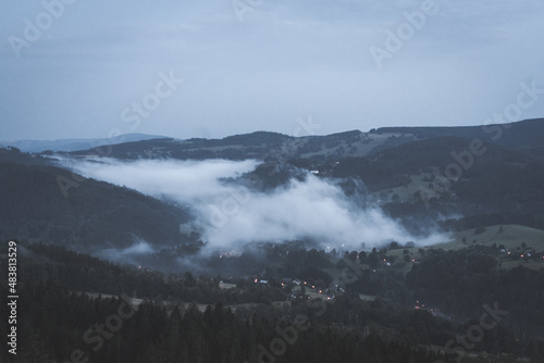 Czech typical autumn landscape. Hills and forest with foggy morning. Morning fall valley of Podkrkonosi, wild Europe. Fog in landscape