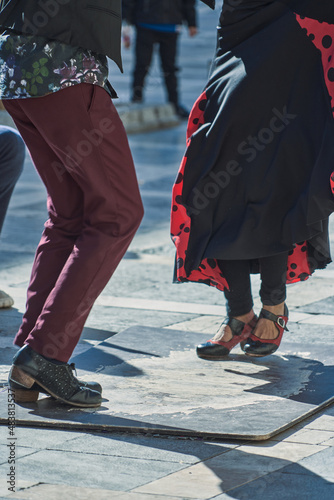 PEOPLE DANCING FLAMENCO IN THE STREETS OF GRANADA