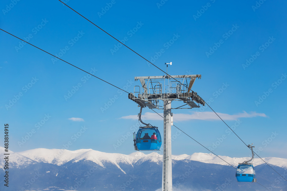 ski resort in Bulgaria, snow-covered track with lift, winter day