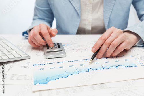 Financial accounting Business woman using calculator