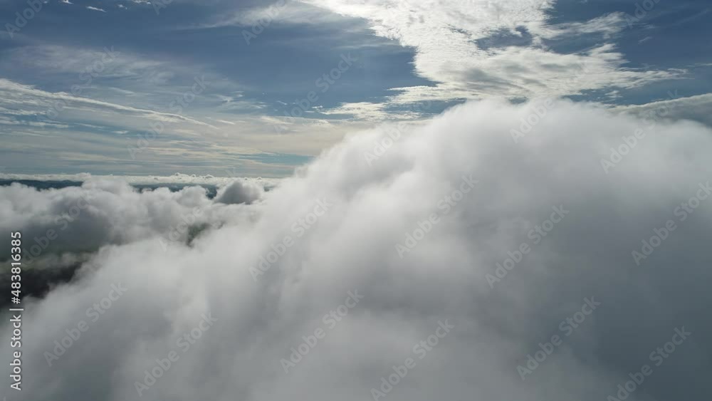 Foggy morning. Rays of sun above the clouds. Sunlight weather. Sunrise cloudscape sky. Panning wide aerial view of fog morning landscape. Foggy morning. Rays of sun above the clouds. Sunlight weather. Sunrise cloudscape sky. Panning wide aerial view of fog morning landscape.