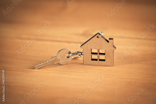 Keys from house on wooden background