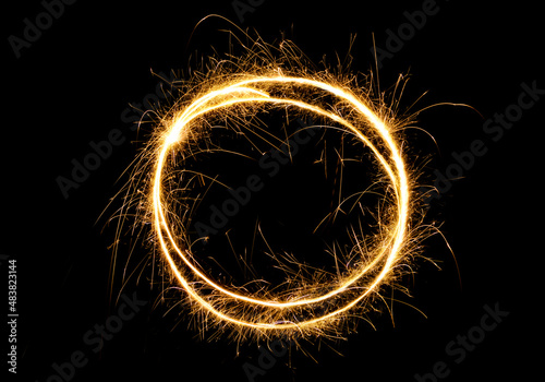 Sparkling round frame isolated on black background
