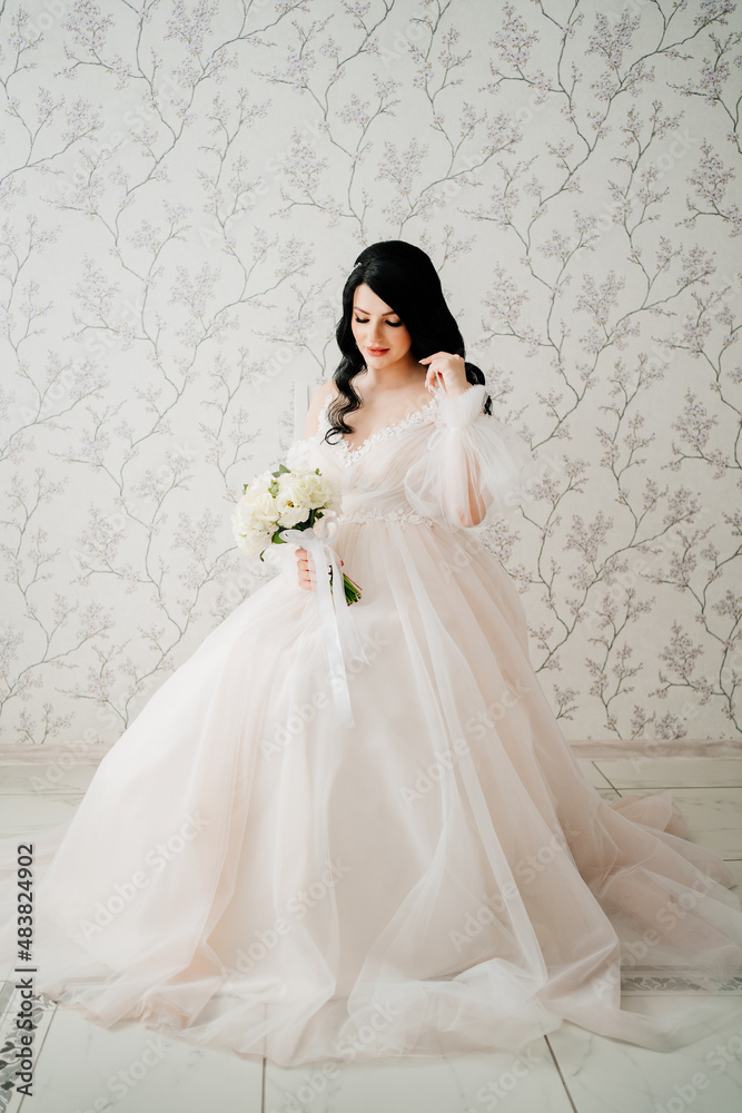 beautiful brunette bride in white dress with bouquet. hair and makeup for bride. beautiful brunette bride in white dress with bouquet. hair and makeup for bride.