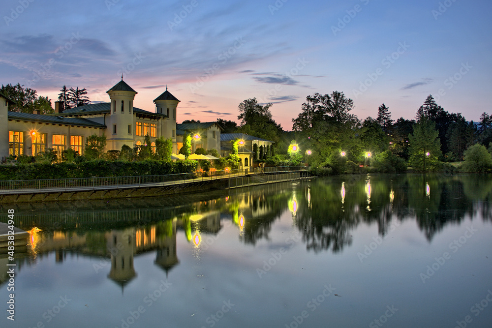 Evening view of the Hilmteich castle with the iconic lake in Graz, Austria