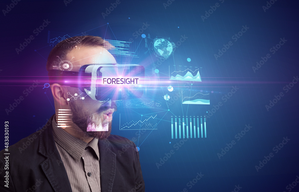 Businessman looking through Virtual Reality glasses Businessman looking through Virtual Reality glasses