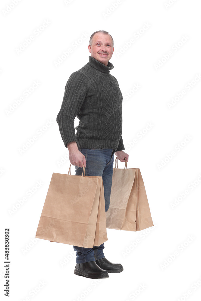 Full length portrait of a young casual man holding shopping bags Full length portrait of a young casual man holding shopping bags