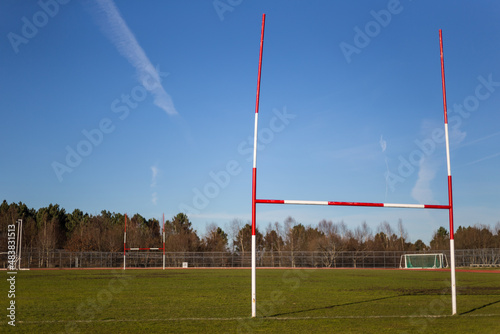 rugby field, perspective view of rugby posts on a blue sky background