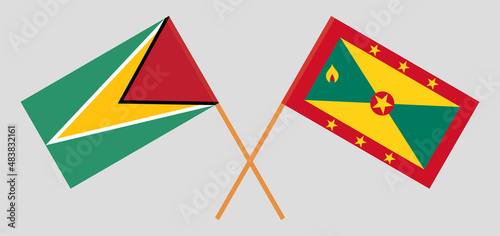 Crossed flags of Guyana and Grenada. Official colors. Correct proportion