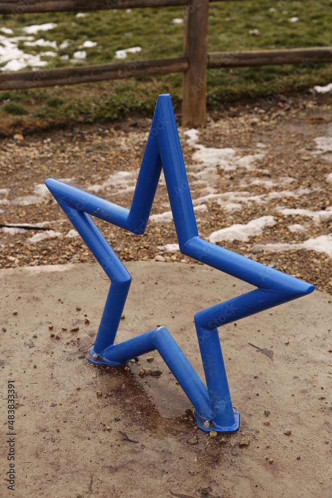 Steel star sculpture painted blue.