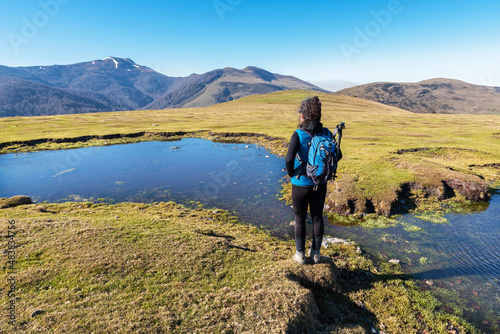 Hiker woman contemplating Mount Adi and Iturrumburu