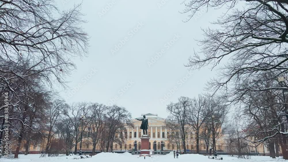 The famous monument to the poet Alexander Sergeyevich Pushkin on the Square of Arts in front of the Russian Museum in the snowfall The famous monument to the poet Alexander Sergeyevich Pushkin on the Square of Arts in front of the Russian Museum in the snowfall