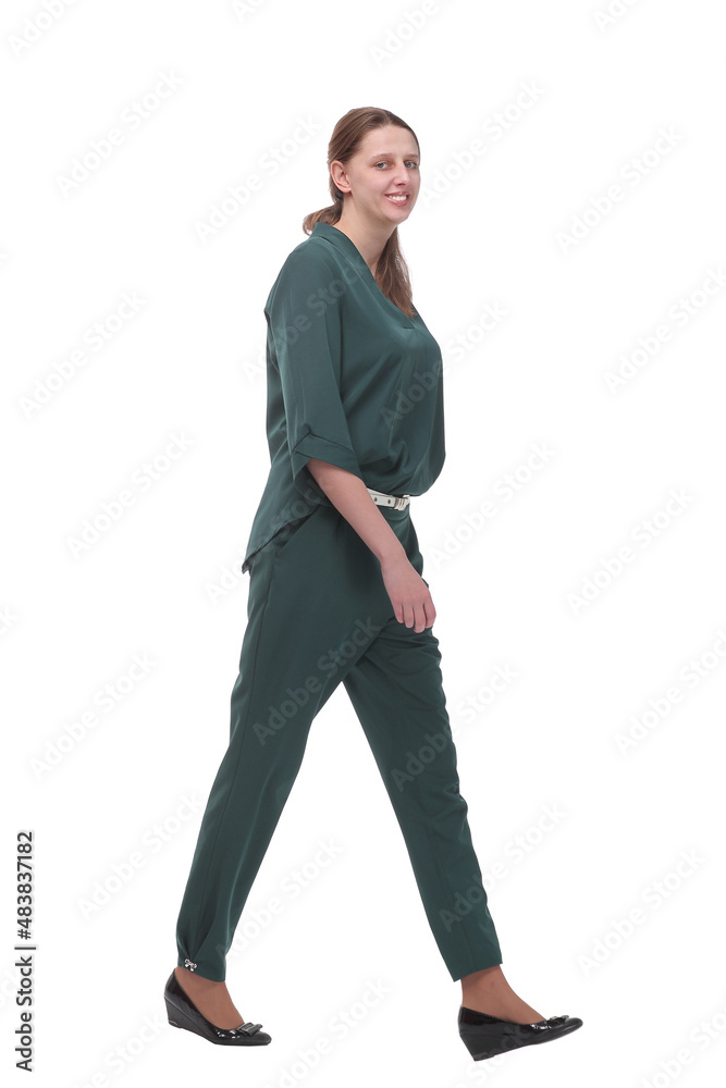 Side view of a business woman walking in full length on white background Side view of a business woman walking in full length on white background