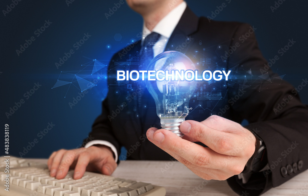 Businessman holding a light bulb Businessman holding a light bulb