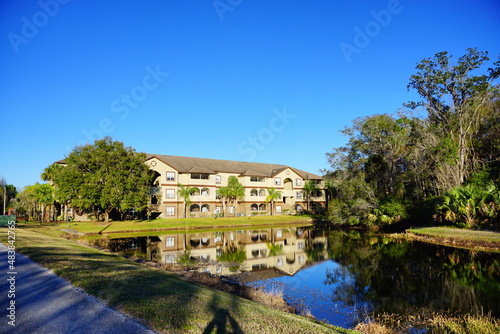 Tampa, Florida, USA, 12 10 2024: The winter foliage landscape of a beautiful apartment community at Tampa Palms, north of Tampa in Florida	
 photo