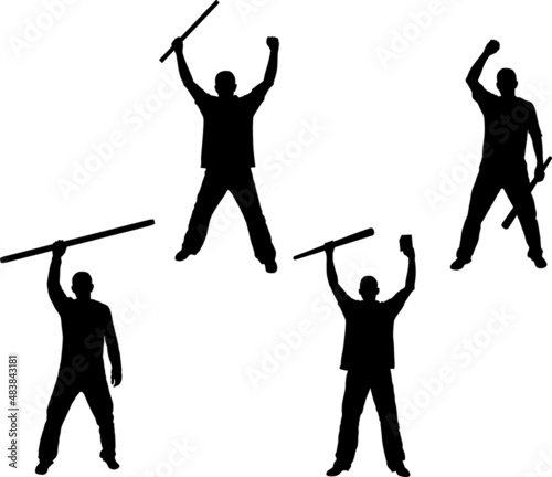 Man holding long rod silhouettes