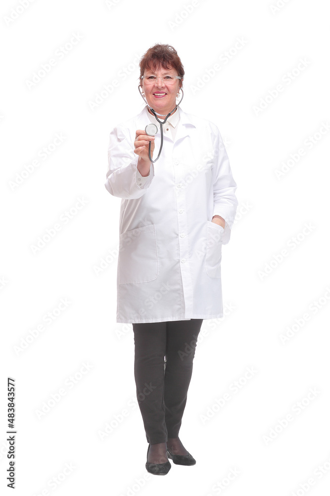 Mature woman doctor with stethoscope in ears and checking listening heart pulse pose Mature woman doctor with stethoscope in ears and checking listening heart pulse pose