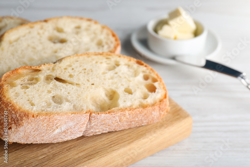 Freshly baked sodawater bread on white wooden table, closeup