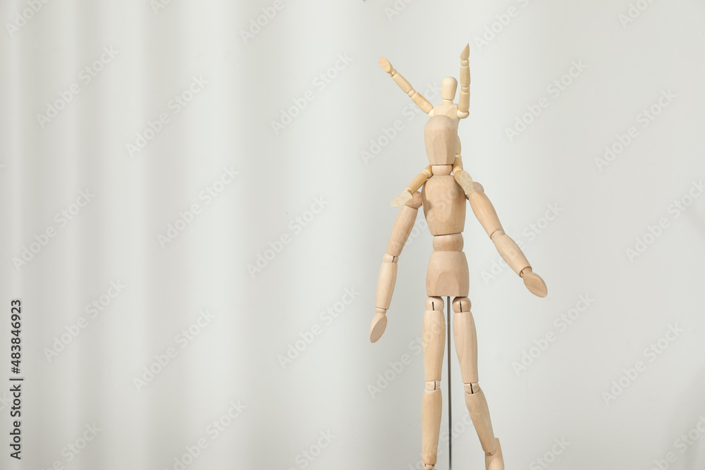 Wooden mannequins of parent with child on light background, space for text. Family Day