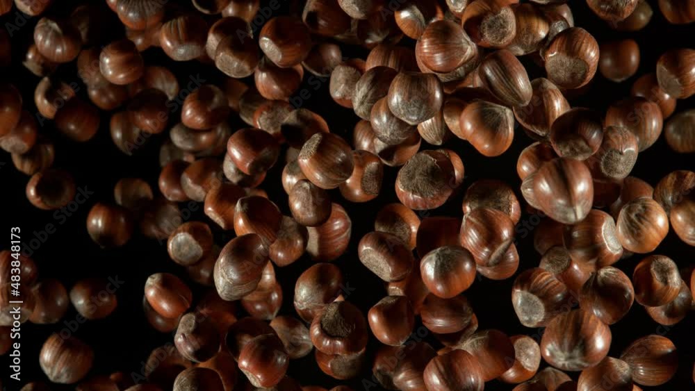 Super Slow Motion Shot of Flying Whole Hazelnuts Towards Camera Isolated on Black at 1000fps. Super Slow Motion Shot of Flying Whole Hazelnuts Towards Camera Isolated on Black at 1000fps.