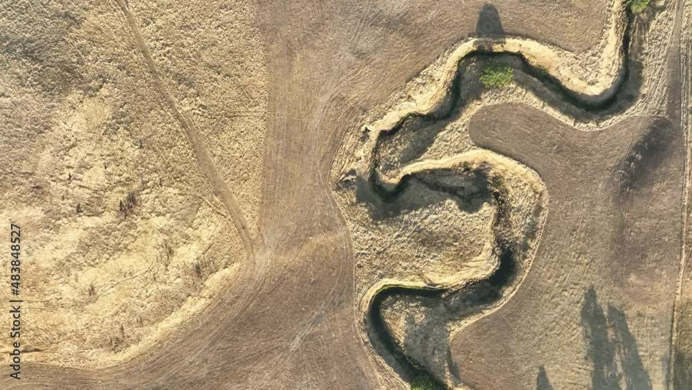 flying over a farm in a summer drought flying over a farm in a summer drought