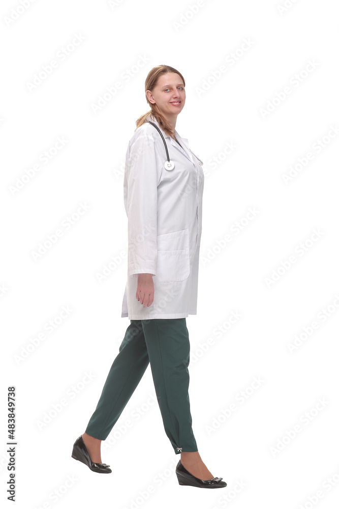 Full length portrait of medical doctor woman going sideways Full length portrait of medical doctor woman going sideways