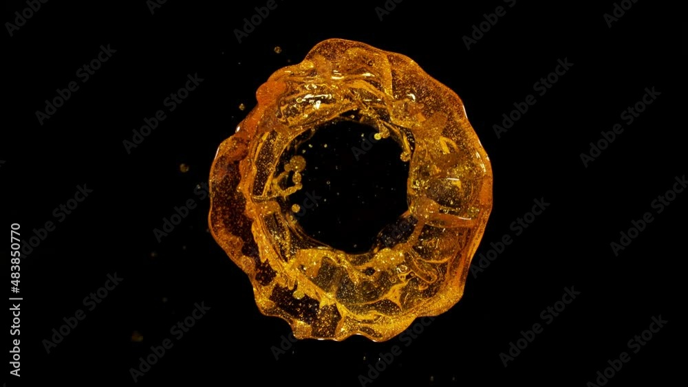Super Slow Motion Shot of Rotating Oil Whirl Isolated on Black Background at 1000fps.