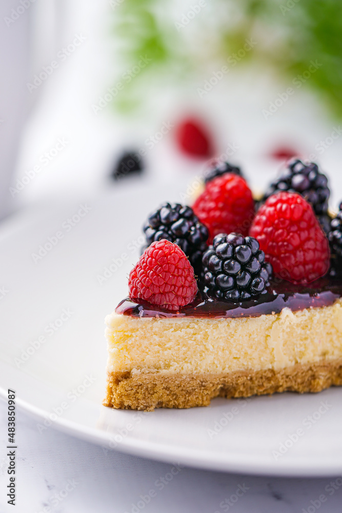 Cheesecakes with fresh berries, raspberry and blackberry.