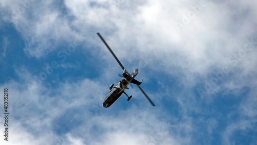 Ultralight helicopter flying over the beach in Tamarindo, Costa Rica