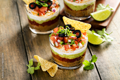 Canvas Print Seven layer dip in individual cups, mexican appetizer