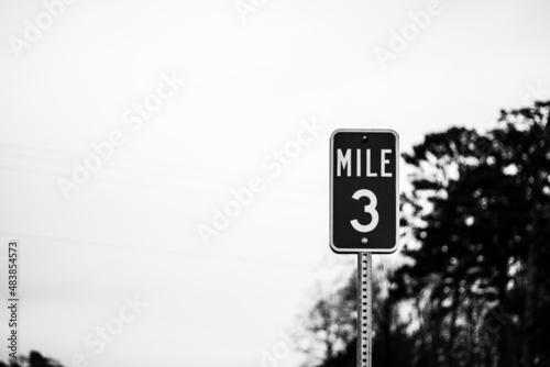 Black and white 3-mile road marker 