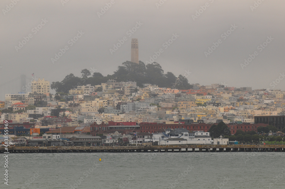 A foggy view of Telegraph Hill and the Coit Tower from the bay, San Francisco, California, USA