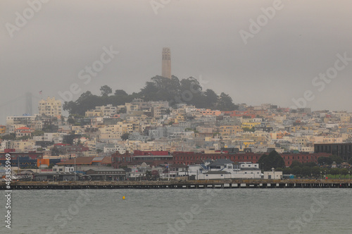 A foggy view of Telegraph Hill and the Coit Tower from the bay, San Francisco, California, USA