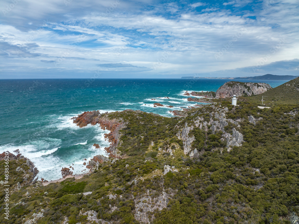 Beautiful high angle aerial drone view of Rocky Cape Lighthouse, part of Rocky Cape National Park, located on the North-West Coast of the island of Tasmania, Australia. Beautiful high angle aerial drone view of Rocky Cape Lighthouse, part of Rocky Cape National Park, located on the North-West Coast of the island of Tasmania, Australia.