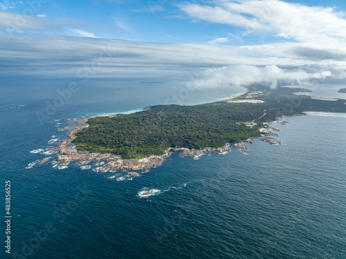Beautiful high angle aerial drone view of St. Helens Point Conservation Area in the evening, a peninsula on the north east coast of Tasmania, Australia. The area is a popular tourism destination.