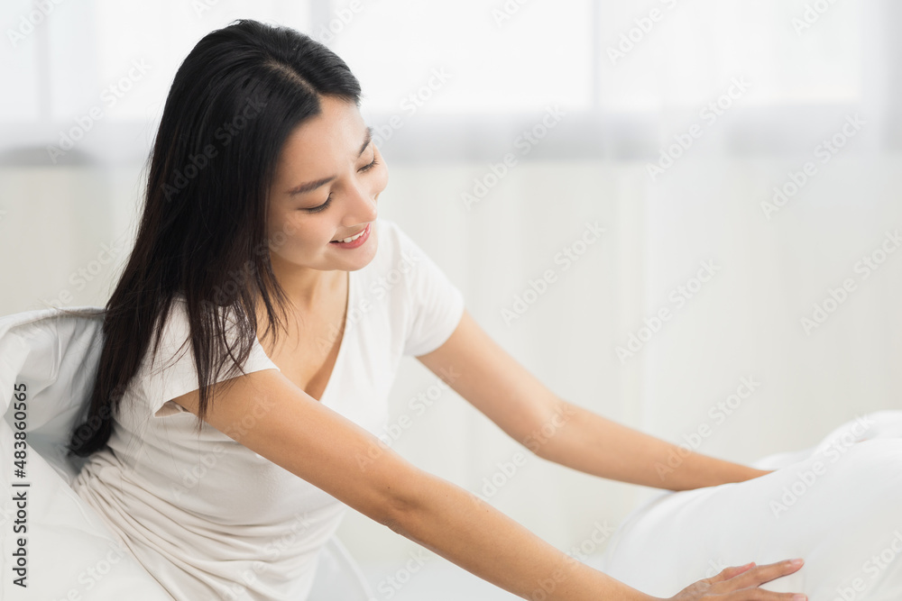Young woman wake up before lying asleep enjoying healthy in the morning. Beautiful asian woman sleeping well in comfortable cozy fresh bed on soft pillow white linen. Young woman wake up before lying asleep enjoying healthy in the morning. Beautiful asian woman sleeping well in comfortable cozy fresh bed on soft pillow white linen.