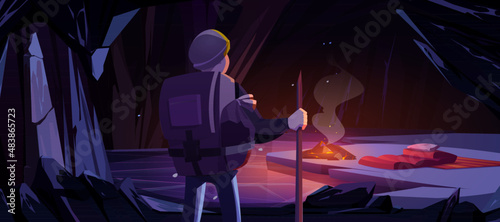 Hiker in mountain ice cave with campfire and sleeping bag, tourist halt, overnight place with frozen pond. Adventure game, book scene with traveler character in dark cavern Cartoon vector illustration