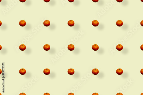 Colorful fruit pattern of fresh pumpkins on yellow background. Top view. Flat lay. Pop art design