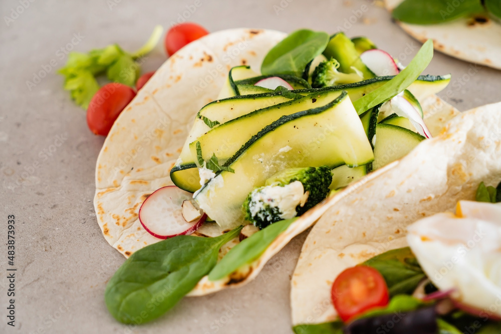 Tasty tortilla with fresh vegetables Tasty tortilla with fresh vegetables