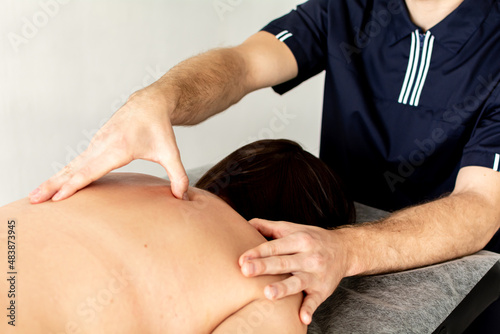 physiotherapist treats the patient. sports massage